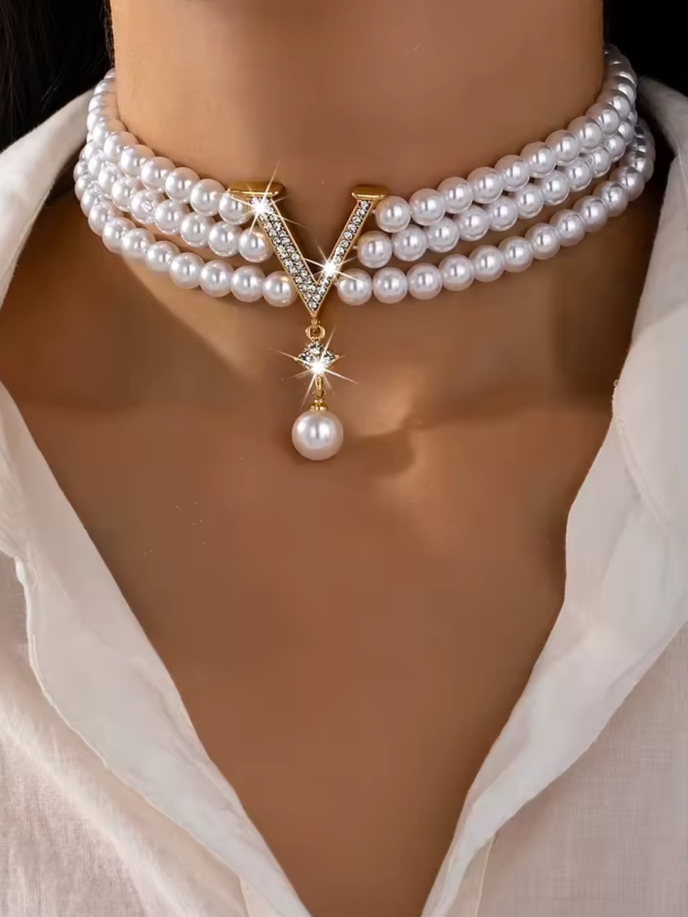 White Pearl Triple-Strand Choker with Gold V Pendant